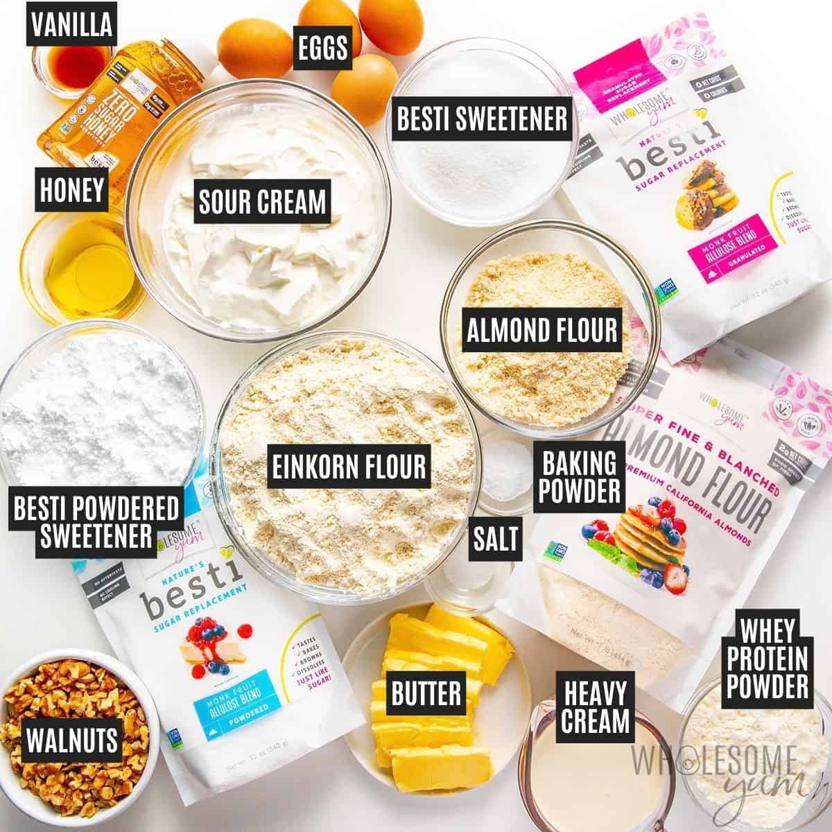 Labeled recipe ingredients: honey, einkorn flour, almond flour, sour cream, Besti Monk Fruit Allulose Blend, eggs, unsalted butter, heavy cream, Besti Powdered Monk Fruit Allulose Blend, whey protein powder, walnuts, baking soda, vanilla extract, and sea salt.