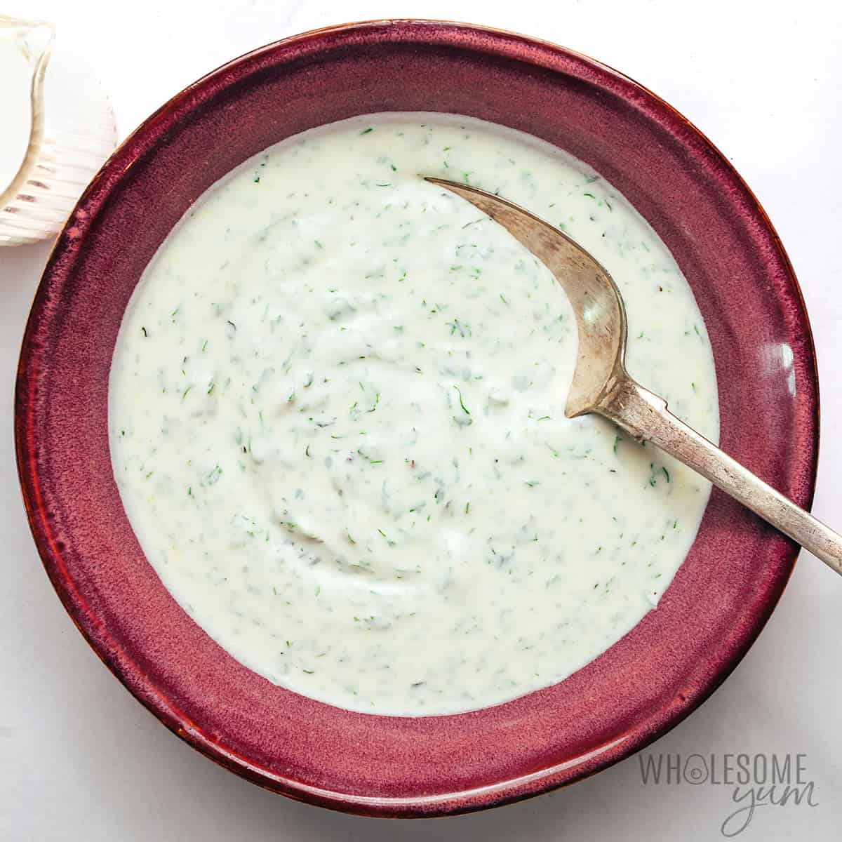 Yogurt herb sauce mixed in a bowl.