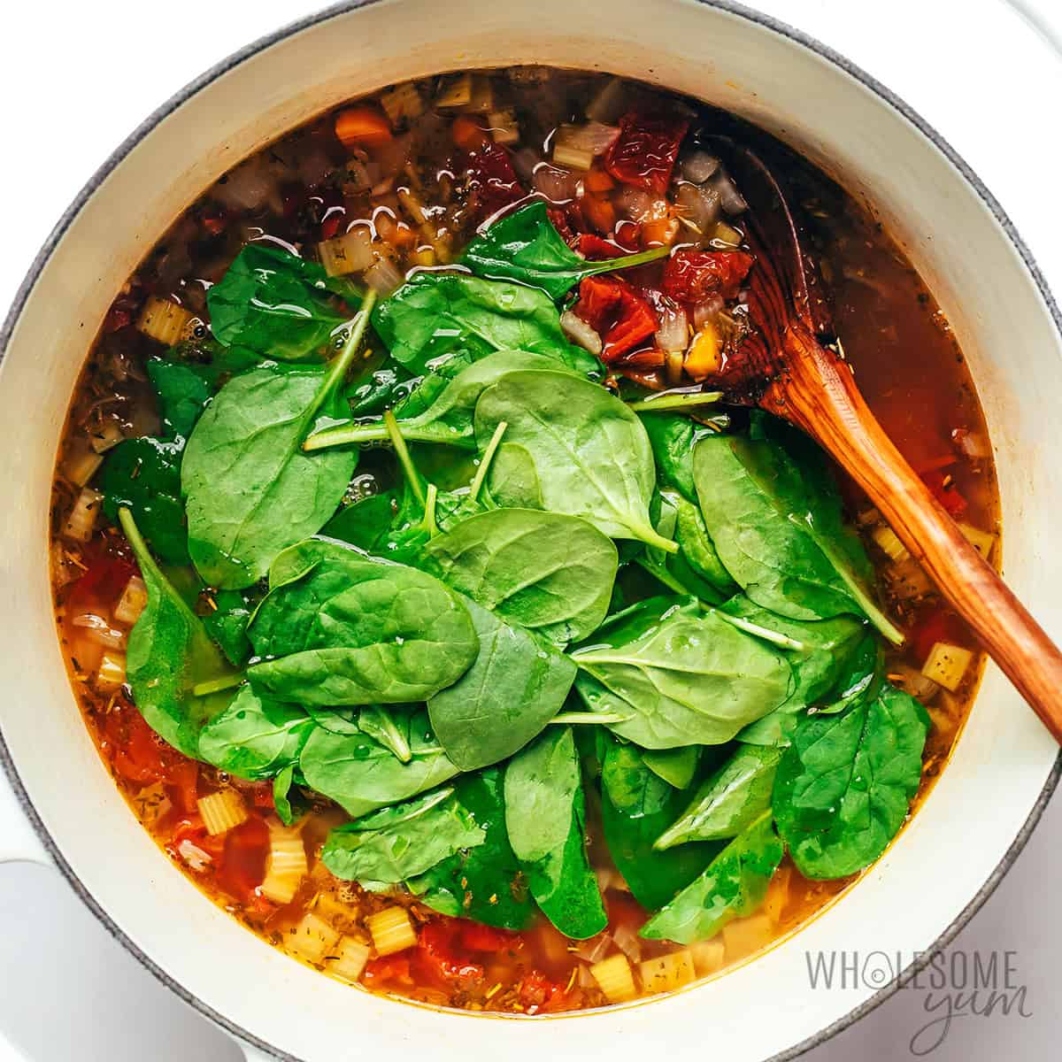 Fresh spinach added to the white bean soup.