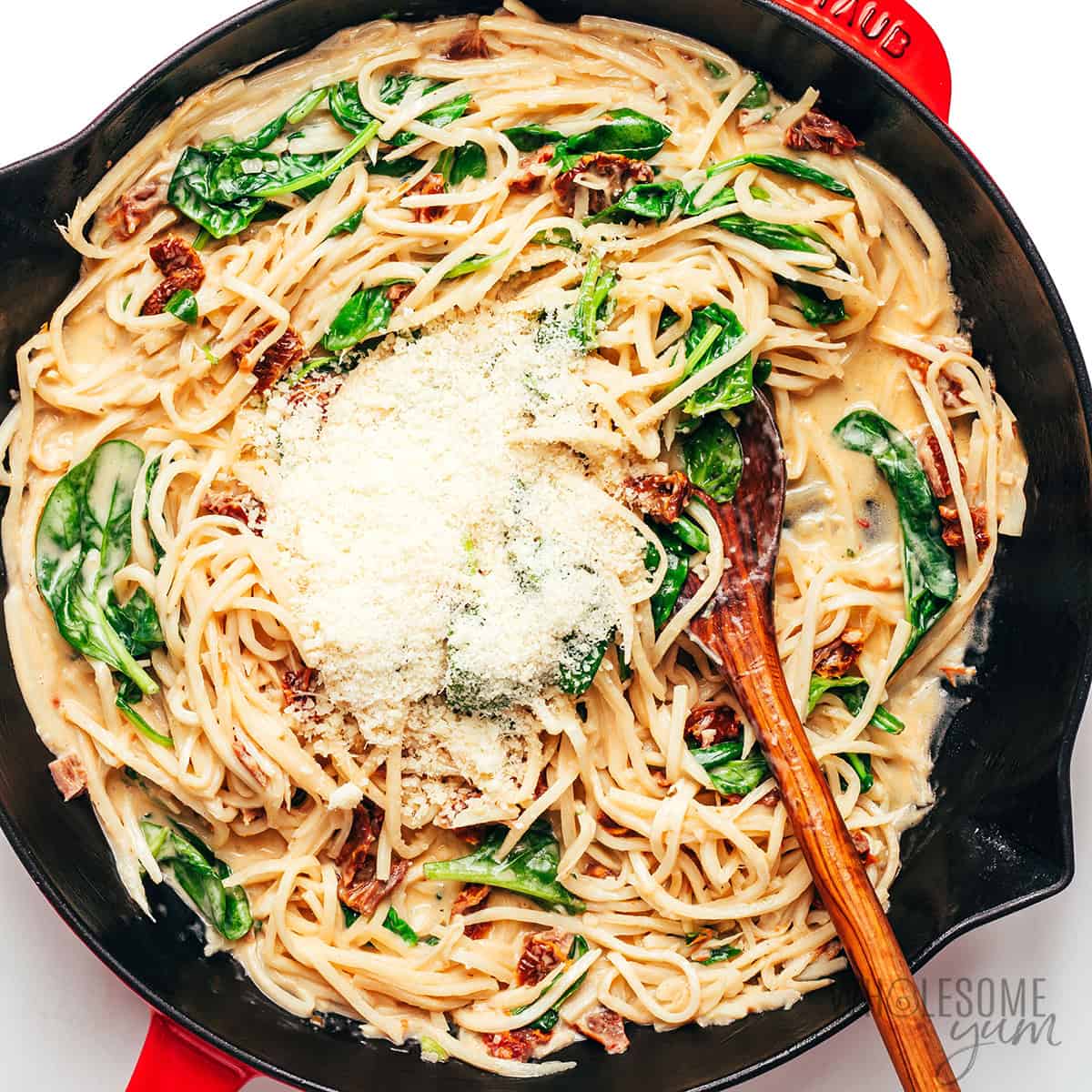 Parmesan cheese added to hearts of palm noodles.