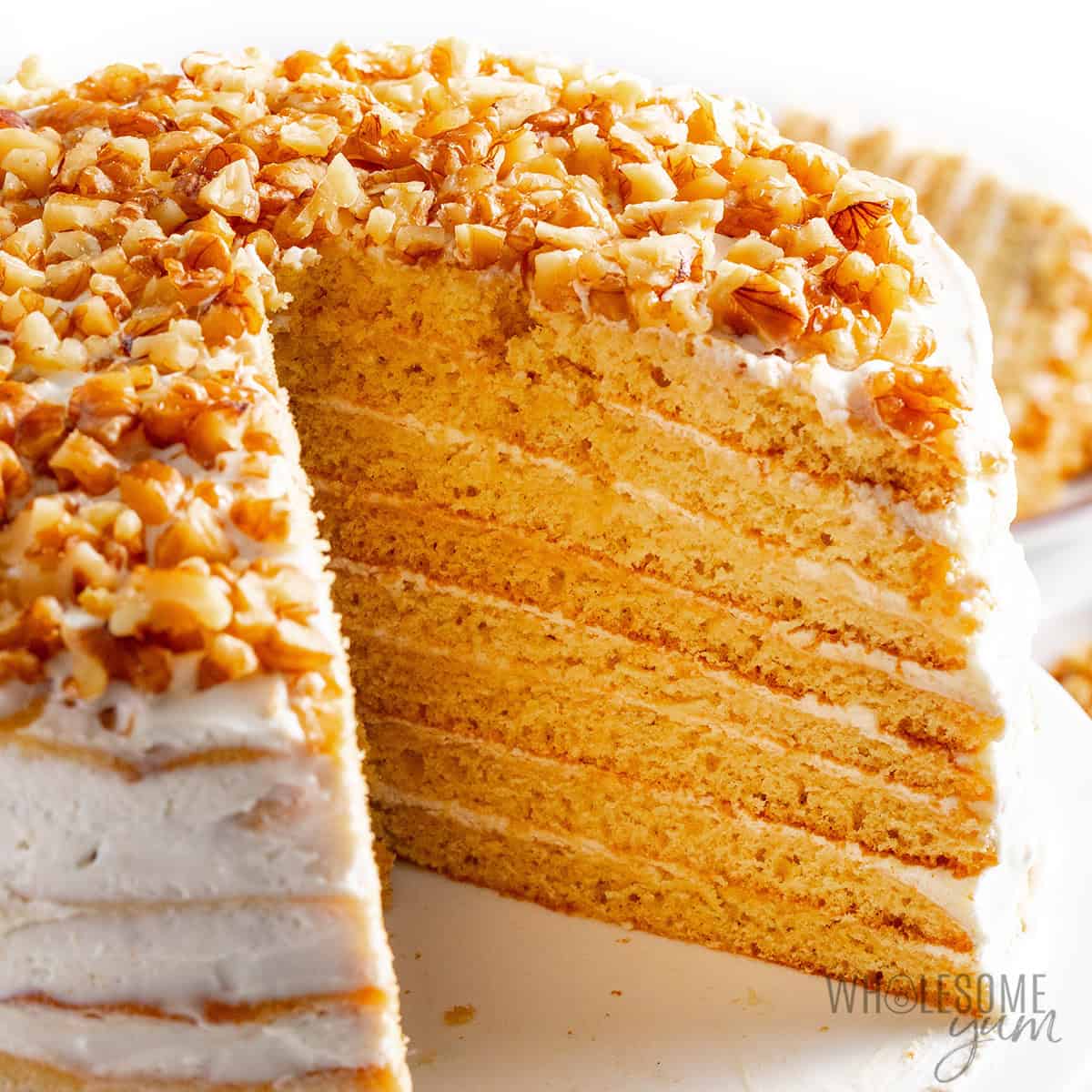 Finished honey cake recipe with slices removed to show the texture inside.