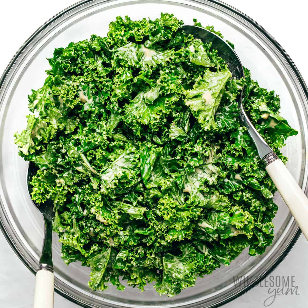 Kale leaves tossed in dressing.