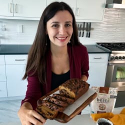 Maya with a pumpkin banana bread loaf.