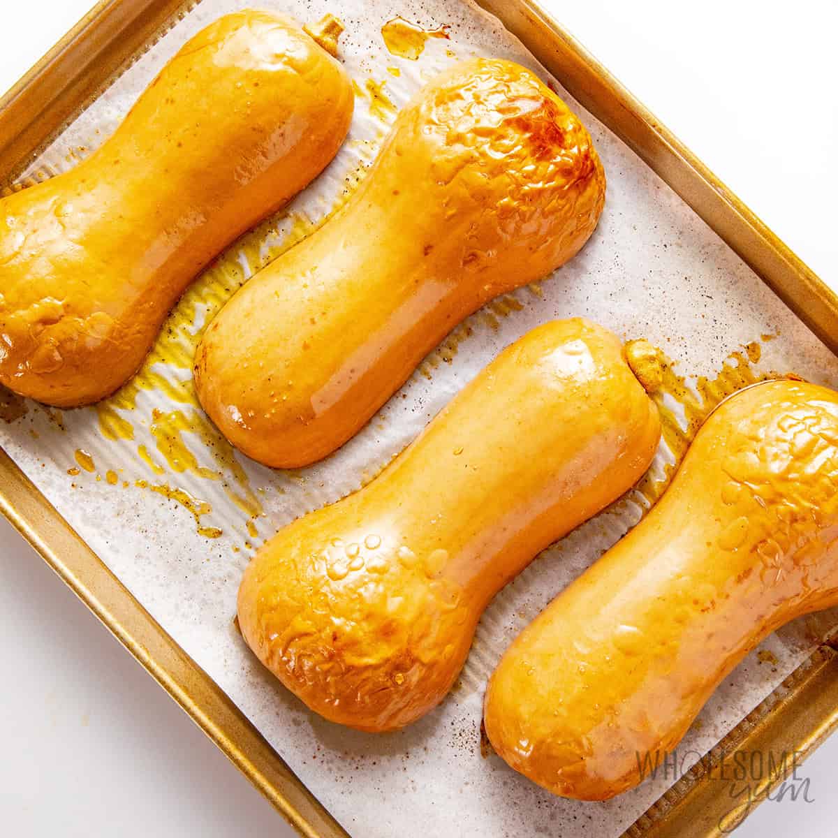 Roasted butternut squash halves.