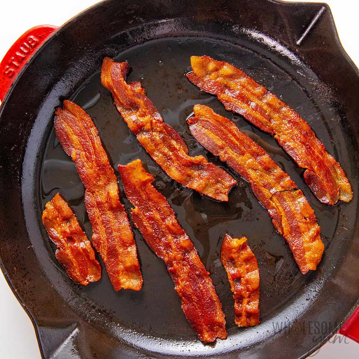Cooked bacon in a skillet.