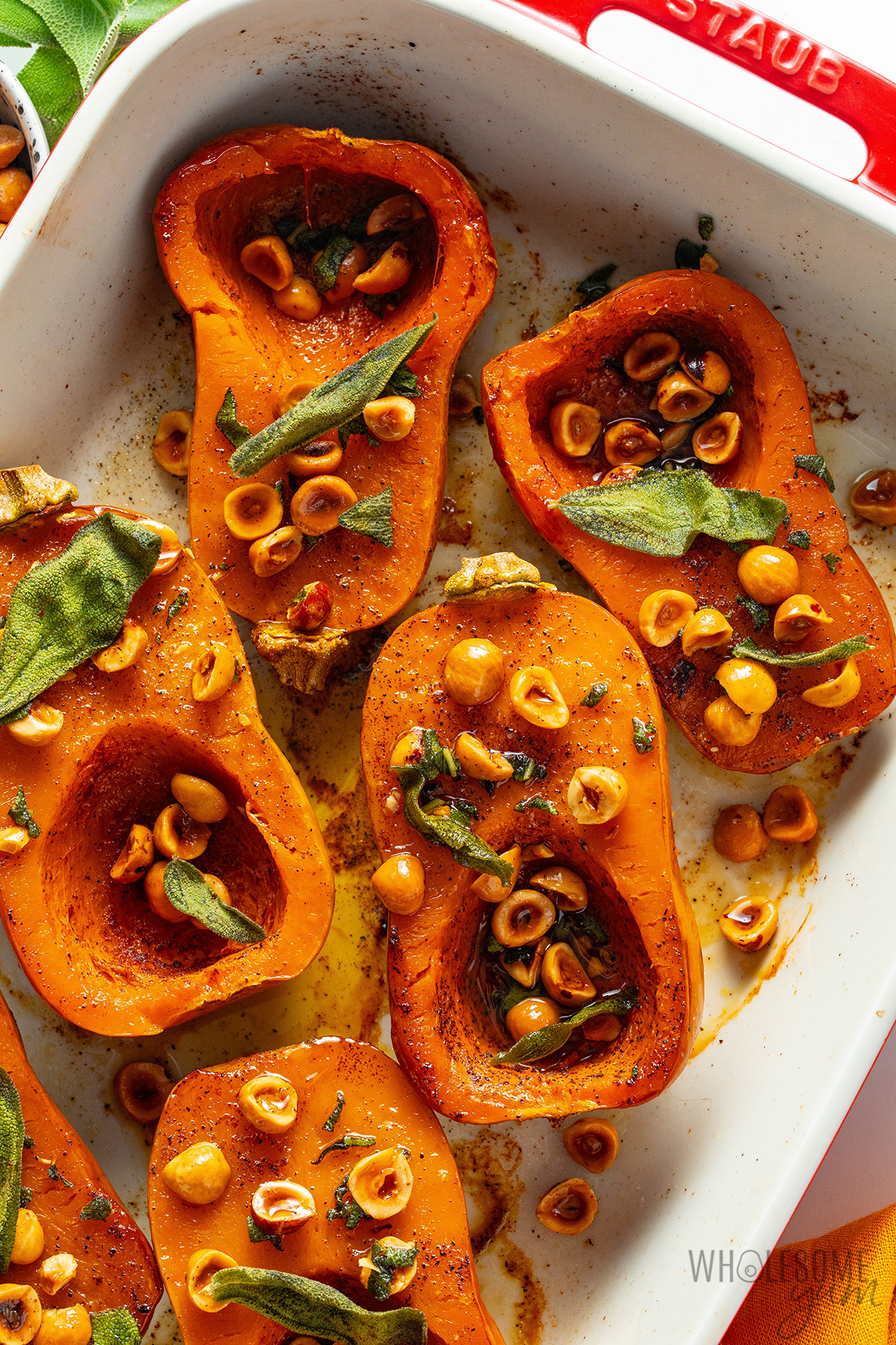 Nutty and tender honeynut squash topped with hazelnuts and crispy sage leaves.