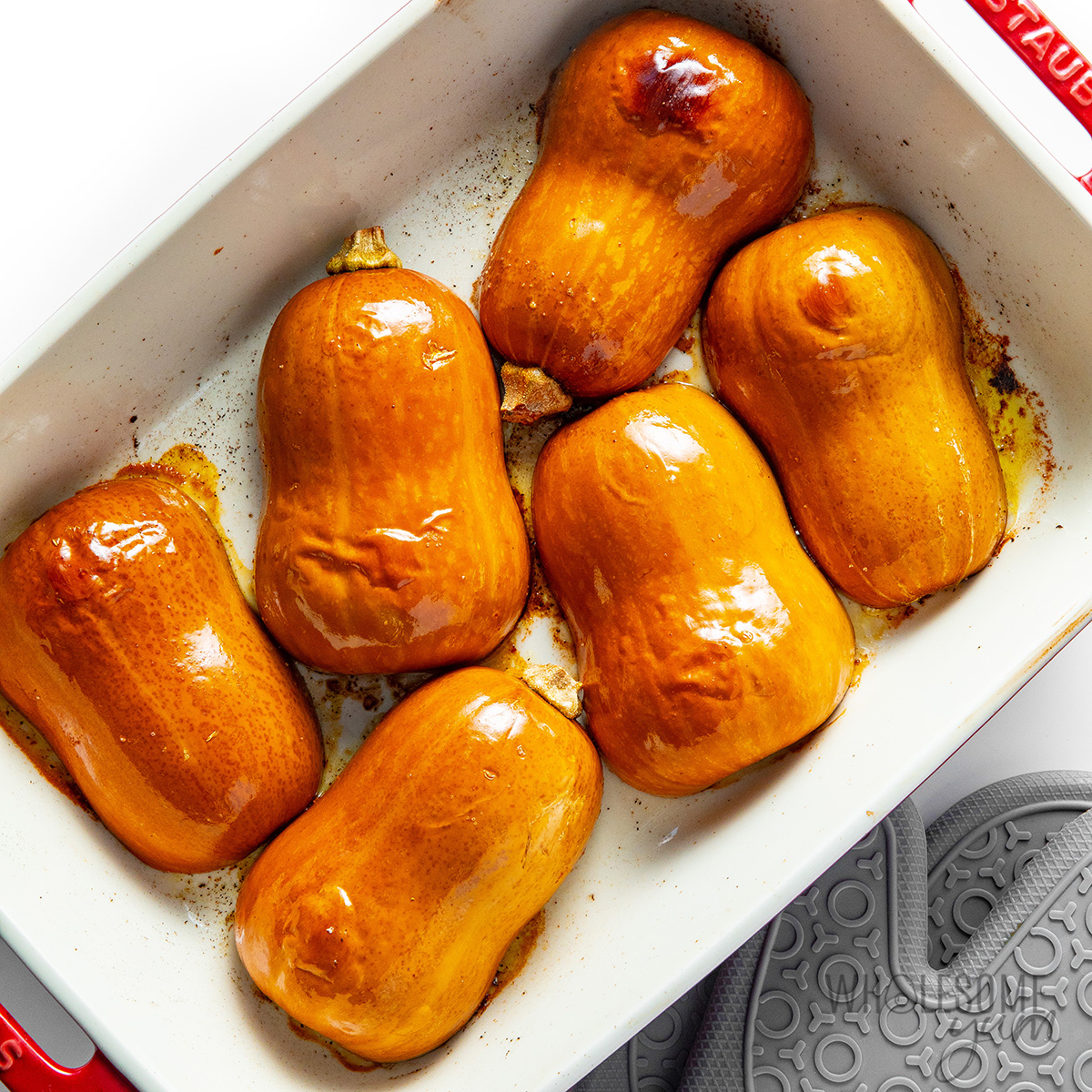 Honeynut squash roasting cut side down.